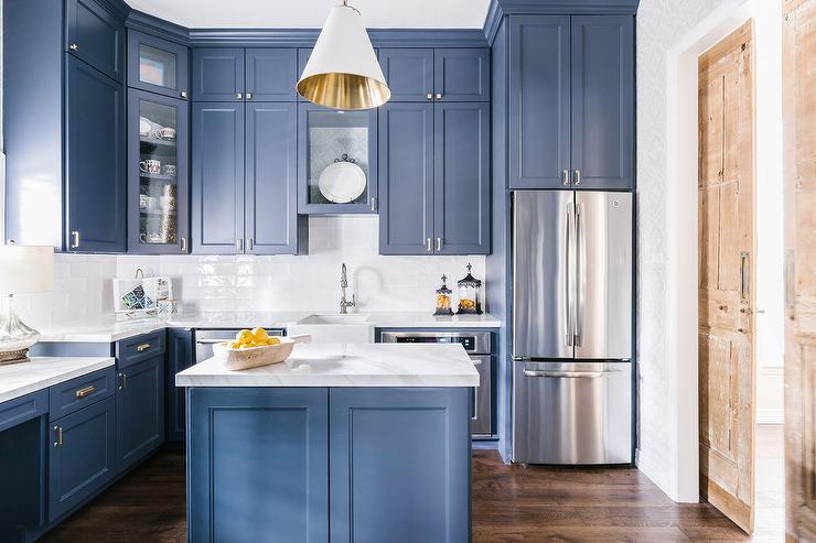 This pretty blue kitchen features tall upper cabinets and and cabinet pulls that are just under 5 inches in total length.
