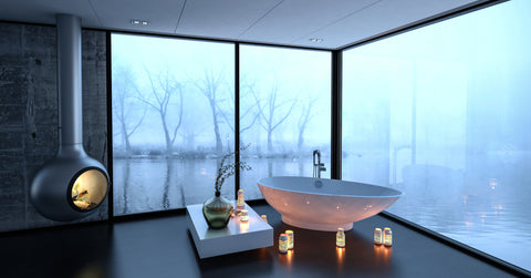 Spa bathroom with black floor, lighting and fireplace