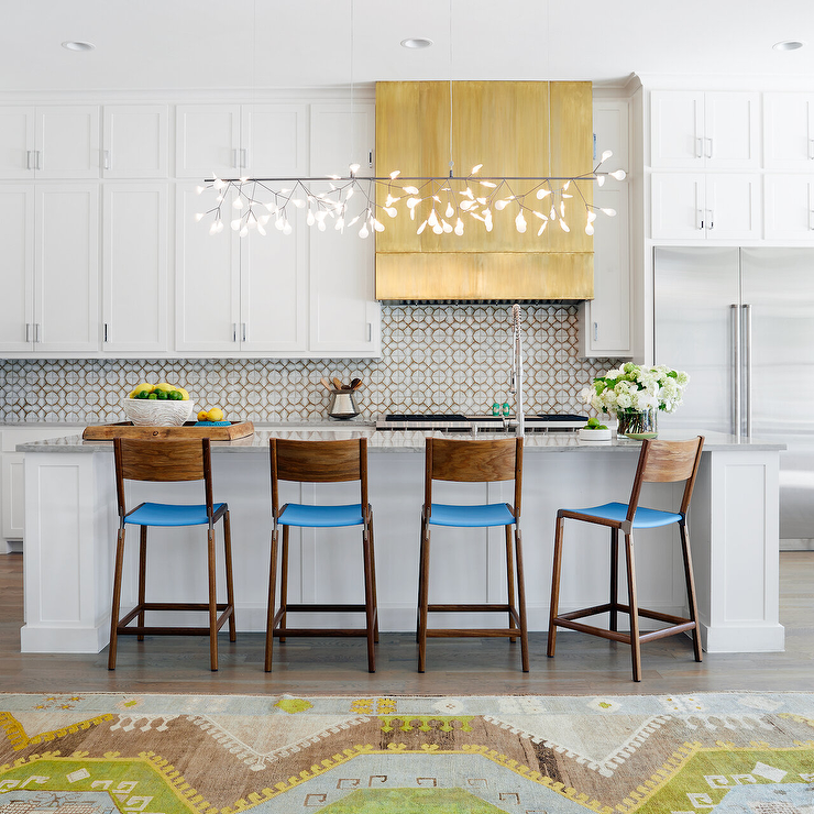 This modern Bo-ho kitchen taking advantage of storage space was clearly a priority. This bank of small ceiling cabinets sport small cabinet pulls.