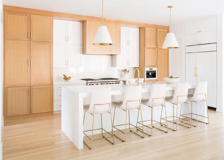 Wood and white kitchen cabinets look good with brushed brass cabinet handles