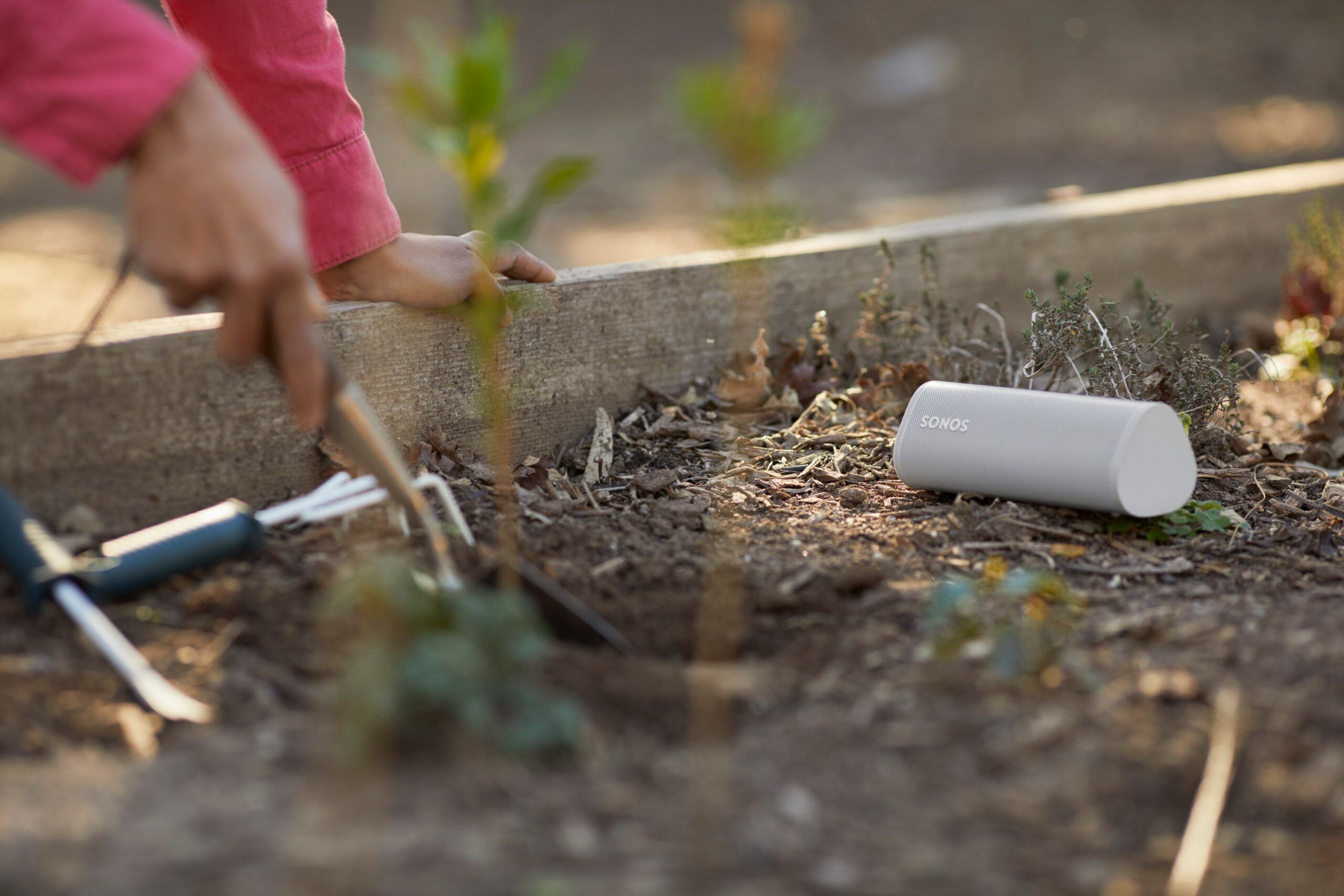 Gardening with White Sonos Roam