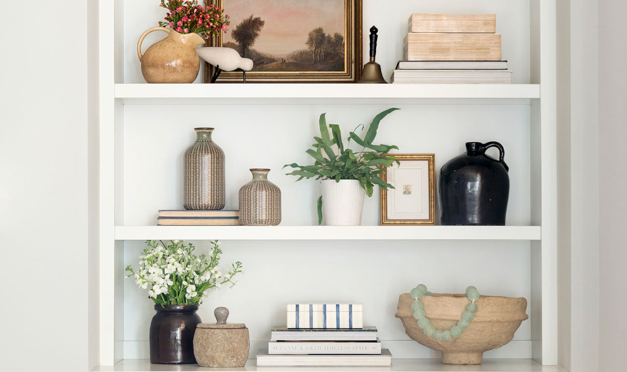 Minimalist White Bookshelf with vases