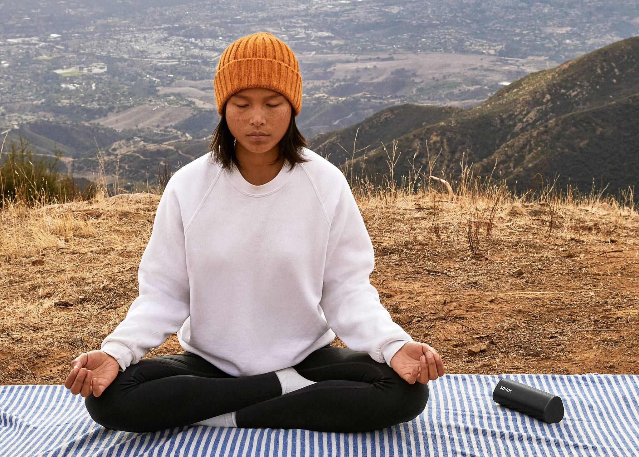 Meditating with black Sonos Roam