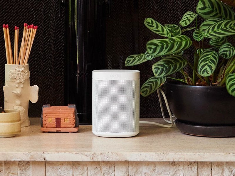 Sonos One White on Table Top next to plant