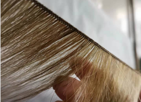 Hand tied hair extensions are how they sound, tied by hand.