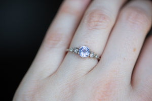 Five stone ring with blue/purple sapphire and grey diamonds