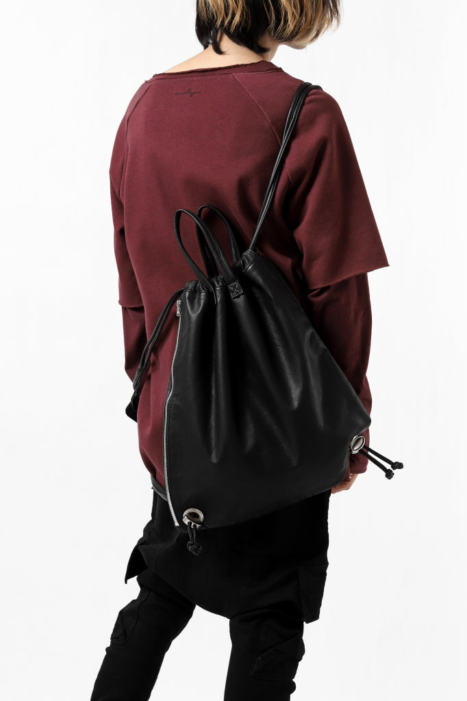 ISAMU KATAYAMA BACKLASH DRAWSTRING BACKPACK / MONOCHROME LUXURY STEER