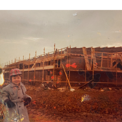 Giles as young boy at factory site in Banbury
