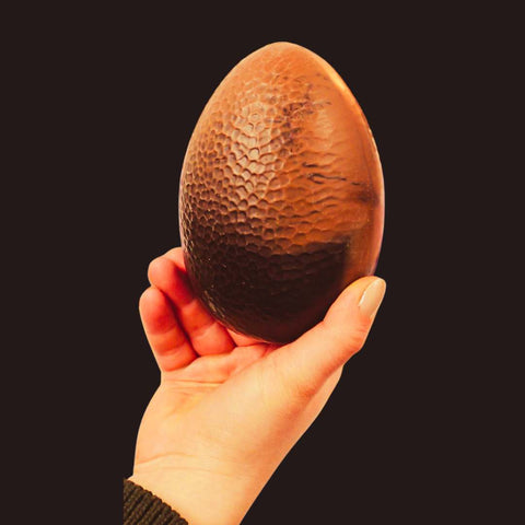 Easter egg held in a hand
