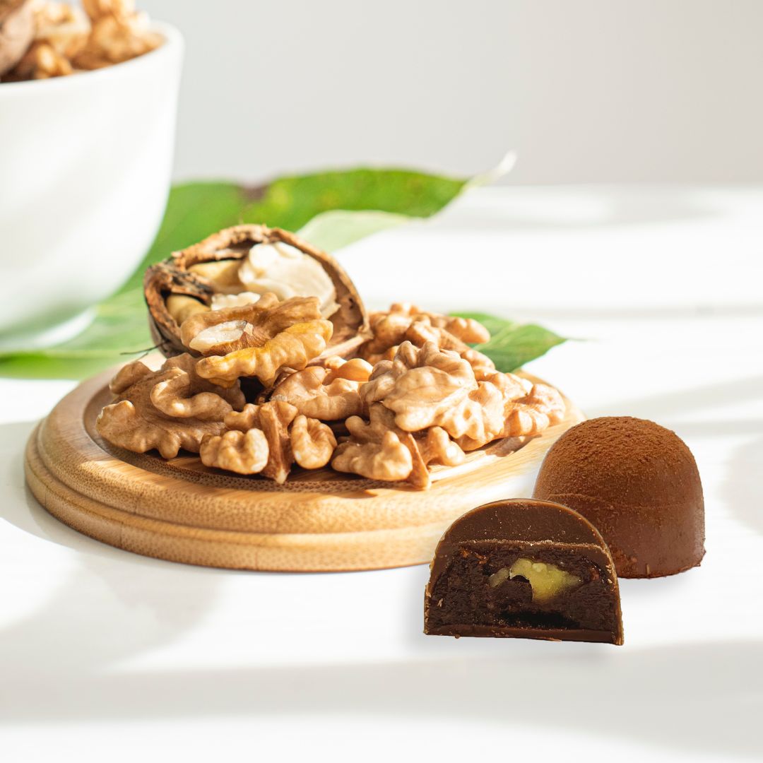 honey and walnut chocolates with walnuts in the background