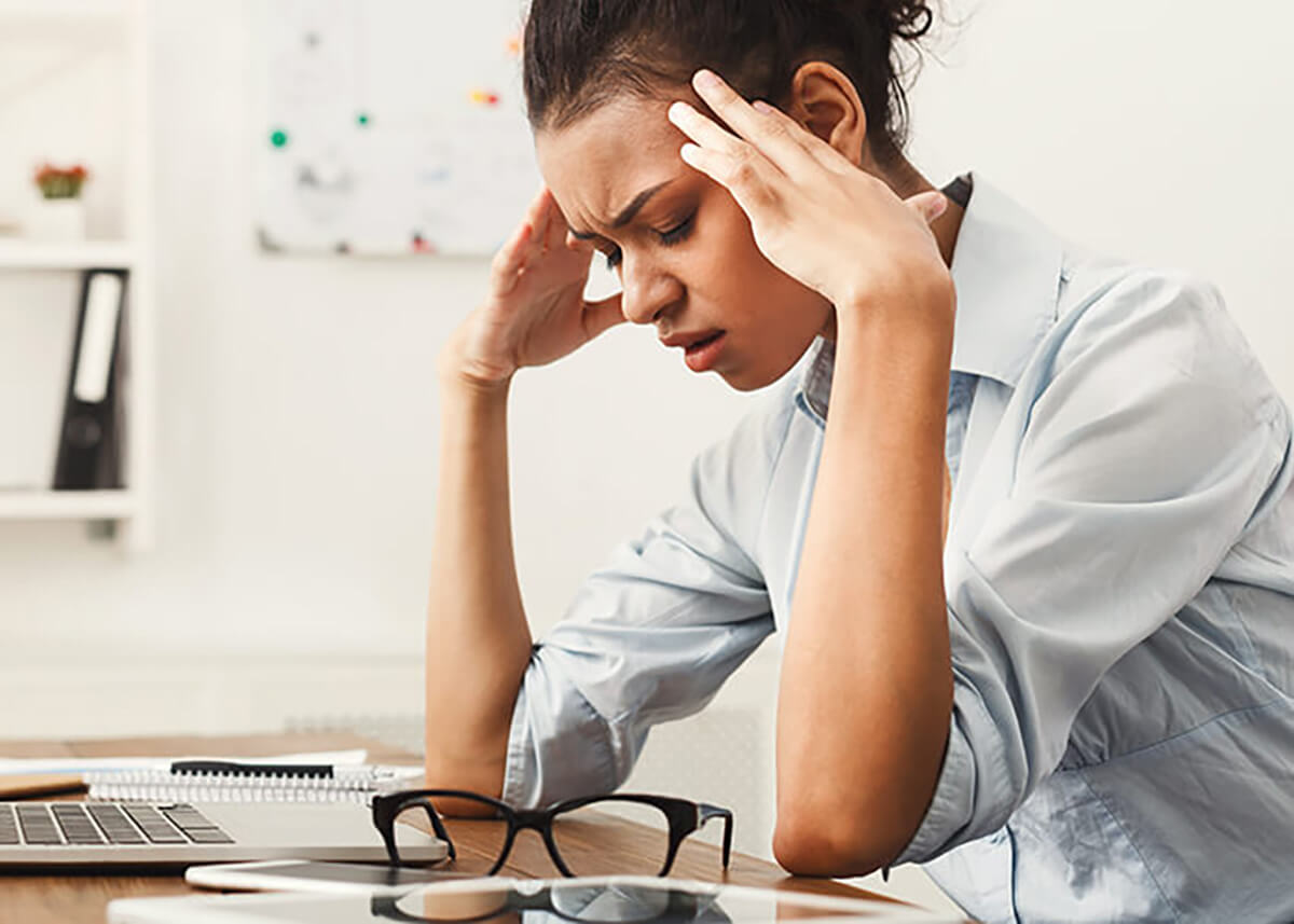 woman experiencing stress at work
