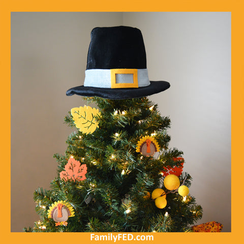 Top a Thanksgiving tree with a pilgrim hat to honor Thanksgiving with a turkey tree while enjoying the Christmas joy, light, and glow.