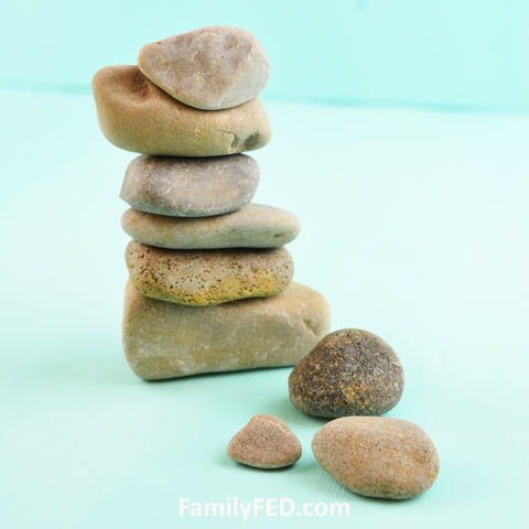 Unpainted rock cairn with rocks from the yard