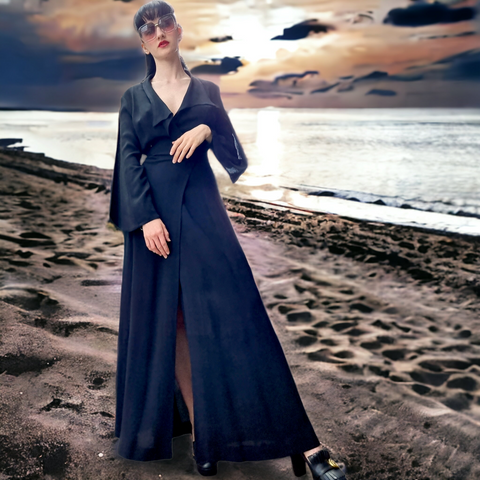 Woman wearing Black Ossie Clark Vintage Maxi Dress on Beach at sunset 