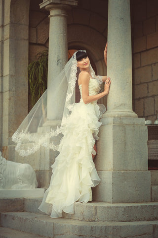 Bride wearing ballet-length or waltz-length veil