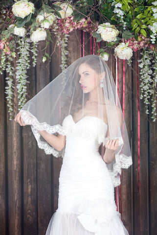 Bride wearing an elbow length bridal veil