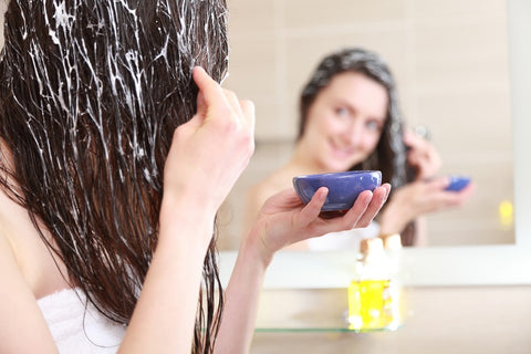 Bridal beauty tips; woman indulging in a hair conditioning treatment