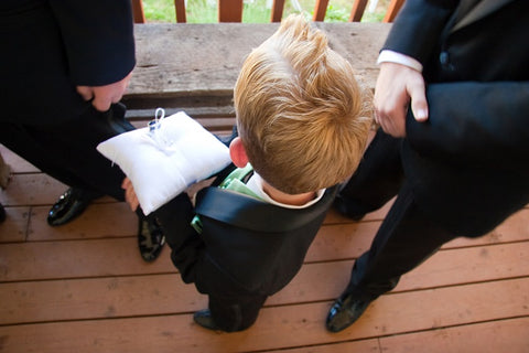 Ring bearer playing his part in a wedding