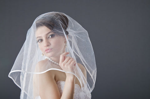  Bride wearing a shoulder length veil