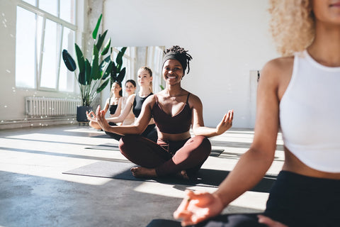 Women in a yoga / meditation class; working on a wedding stress relief plan