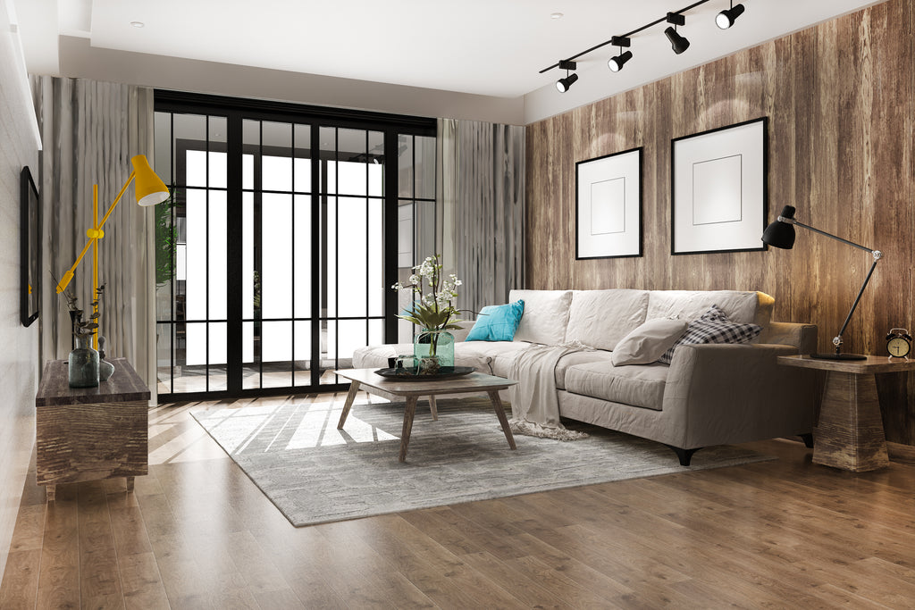 Sala de estar decorada con la tendencia quiet luxury con amplias ventanas y muebles minimalistas