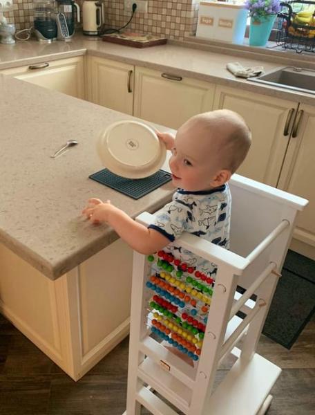 Little partner helps to make coffee and cook
