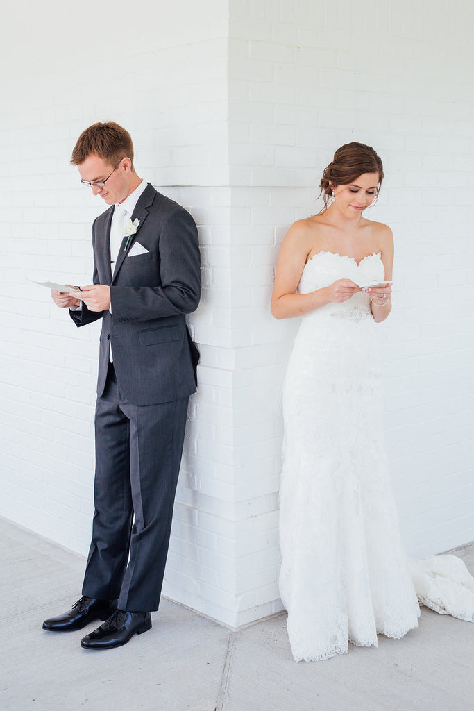 A cute photo of the bride and groom reading their letters! | A Simple & Stunning Sage Wedding | Kennedy Blue | Rachel Figueroa Photography