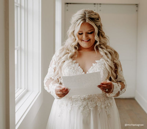 Bride reading a note on her wedding day