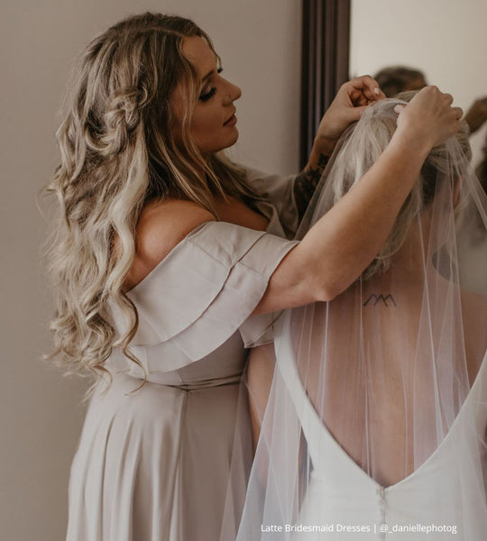 Bridesmaid Helping Bride