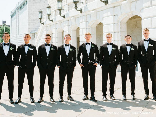 Groomsmen and Groom wearing Black Suits