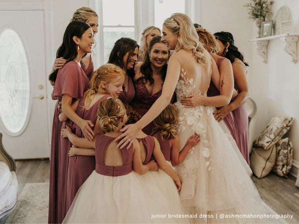 Bridal Party and the bride hugging