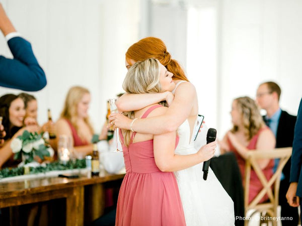 Bride Hugging the Maid of Honor