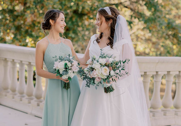 Milly Sage Green Bridesmaid Dress Standing Next to the Bride