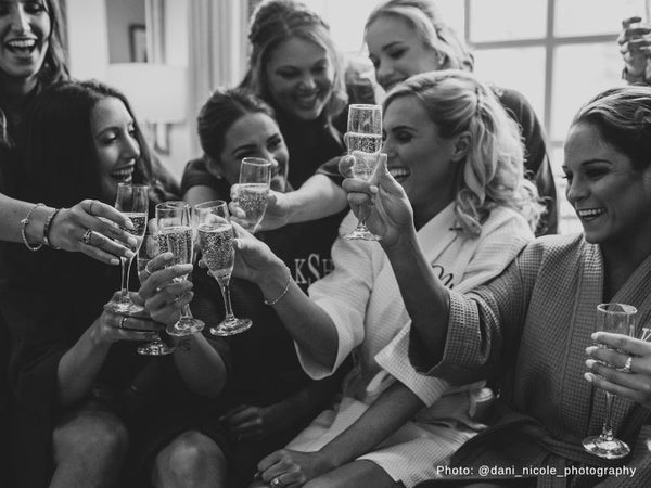 Bridesmaids Cheering with Champagne