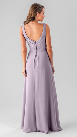 Kennedy Blue model wearing a sophisticated gown with a ruched bodice and a pleated skirt.
