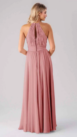 Kennedy Blue model wearing an elegant dress with a high halter neckline and a pleated back with a keyhole. 