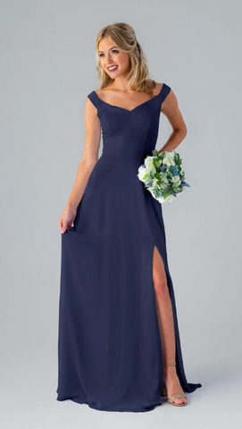 Kennedy Blue model wearing an elegant dress with a sweetheart neckline and off the shoulder straps.