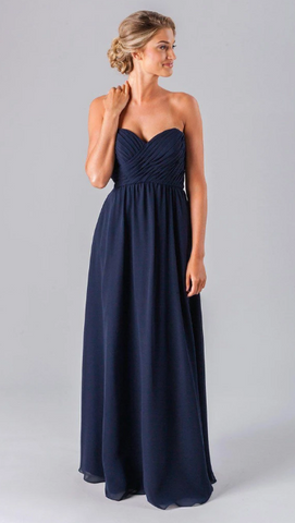 Kennedy Blue model wearing a romantic dress with a strapless sweetheart neckline, fitted bodice, and a flowy skirt.