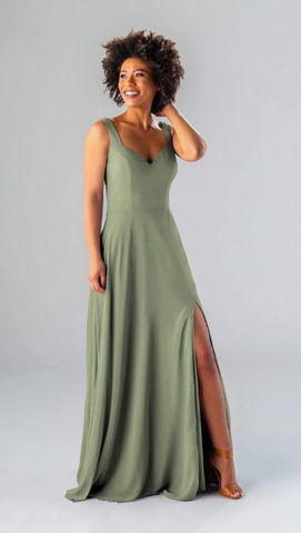 Kennedy Blue model wearing an elegant dress with a sweetheart neckline and a side slit.