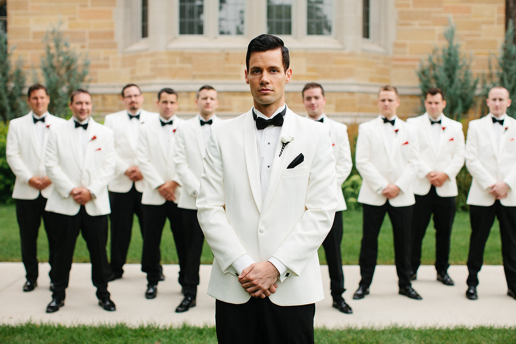 These guys had an old-Hollywood style with their stunning white suits and black bow-ties. | A Timeless and Traditional Mansion Wedding