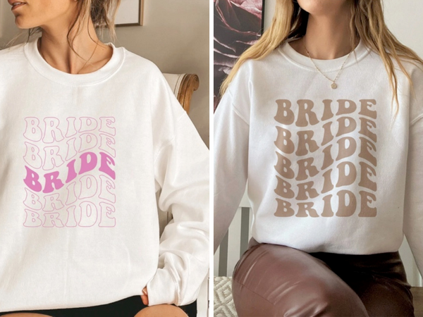Model wearing a comfy sweatshirt with "bride" written in a retro font.