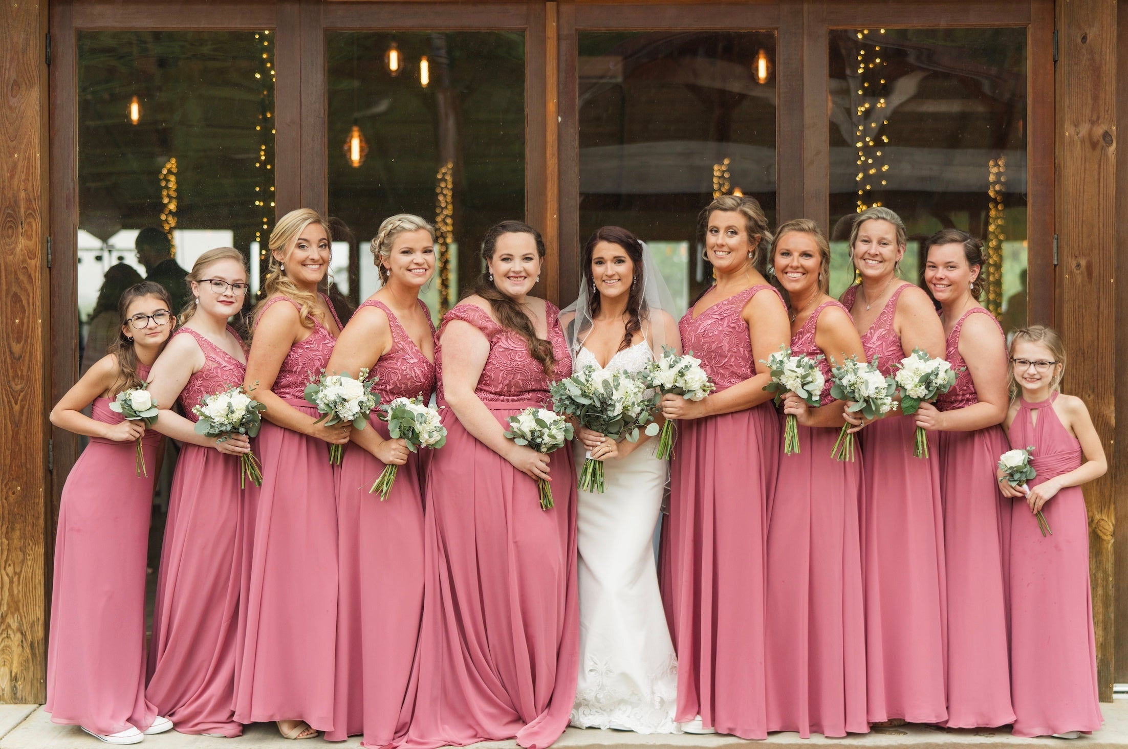 Bride and Bridal Party wearing Kennedy Blue Bridesmaid Dresses in 'Rosewood'.