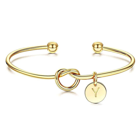 gold knot cuff bracelet with circle charm stamped with letter M - OurCoordinates