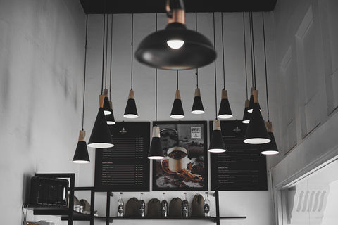 Black pendant hanging lights from ceiling.