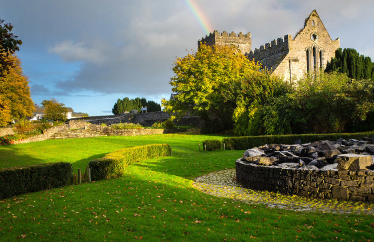 Ireland green landscape castle and rainbow