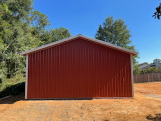 METAL PANELS ON BLACKWATER TRUSS POLE BARN