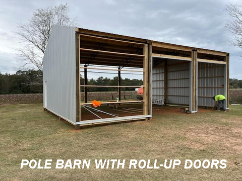 POLE BARN WITH ROLL UP DOORS BEING INSTALLED
