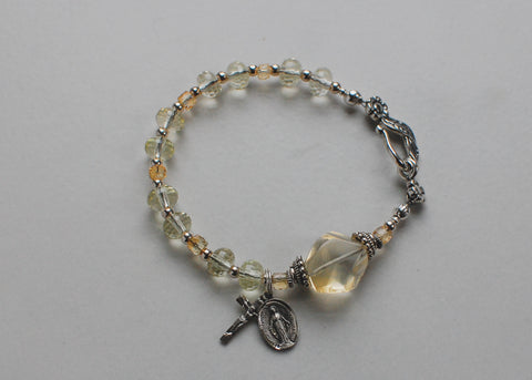 citrine rosary bracelet soft flex wire yellow beads, sterling silver accents crucifix and miraculous medal.