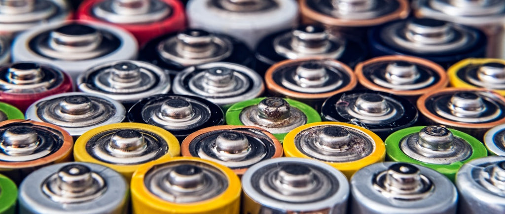 Many different batteries lined up in rows.