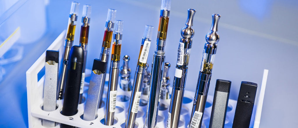 A row of a dozen different cannabis vaporizers.